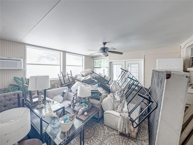 living room featuring ceiling fan and a wall mounted AC