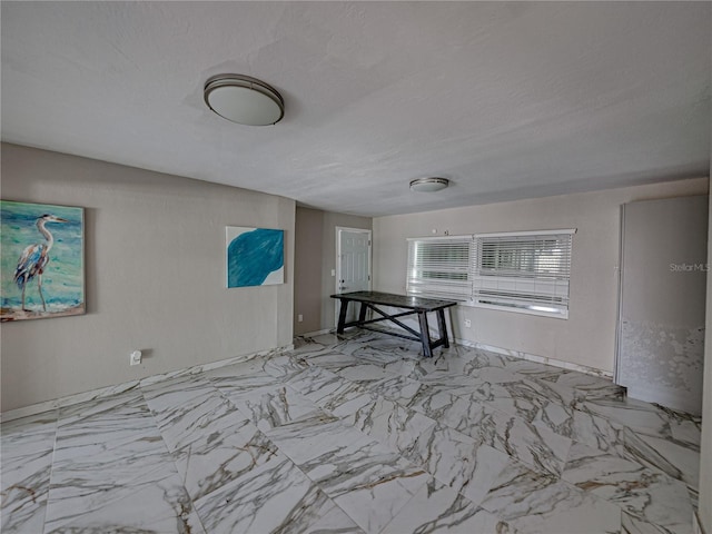 spare room featuring a textured ceiling