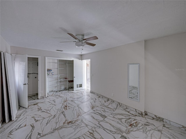 unfurnished bedroom featuring ceiling fan