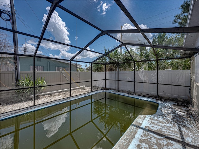 view of swimming pool with a lanai