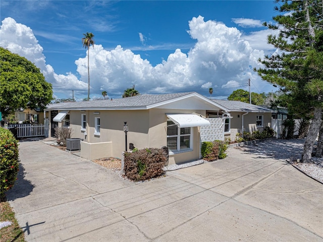 view of front of home featuring cooling unit