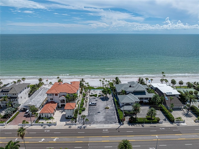 aerial view with a water view and a view of the beach