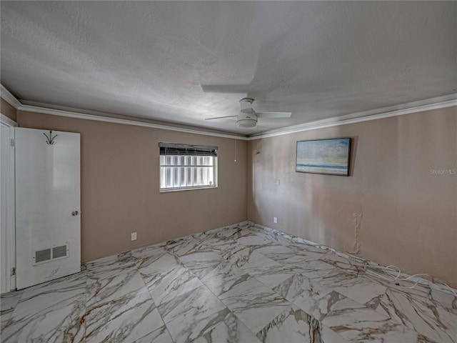 empty room with a textured ceiling, ceiling fan, and crown molding