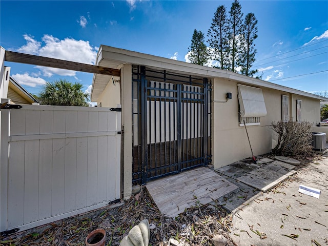 doorway to property featuring central AC