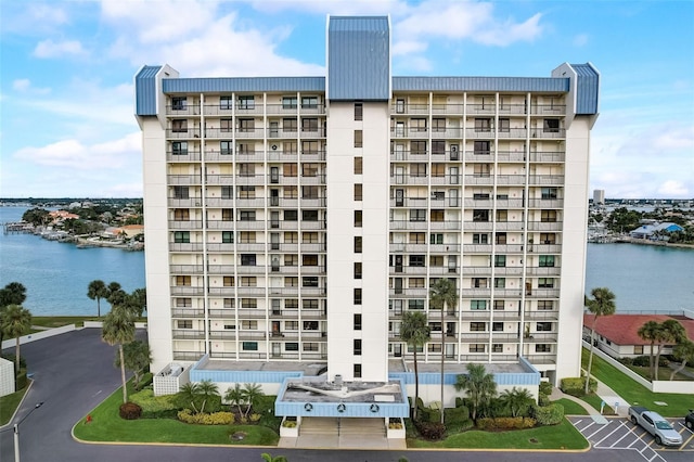 view of building exterior with a water view