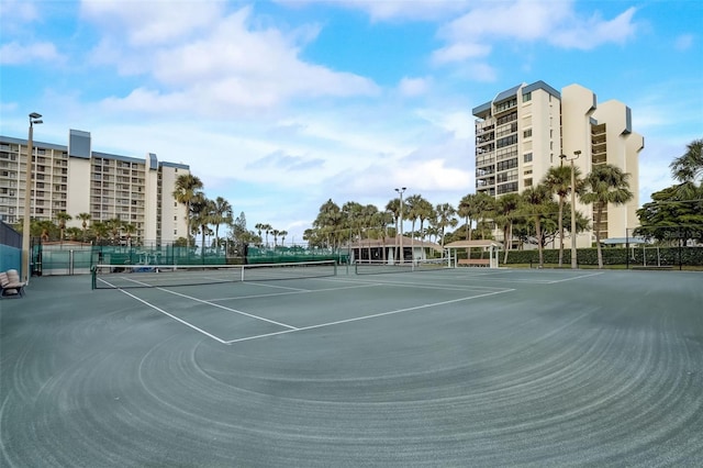 view of sport court with fence