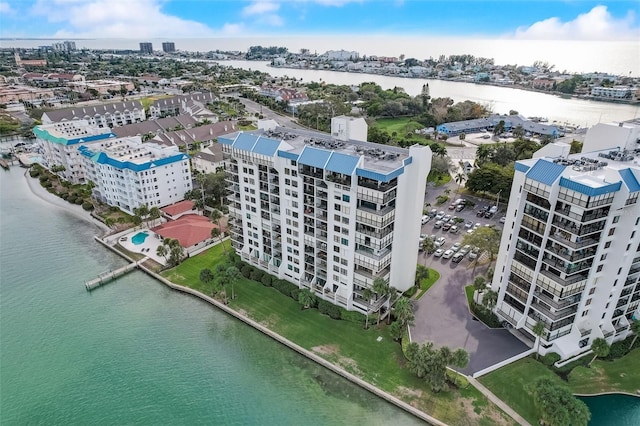 birds eye view of property with a water view and a city view