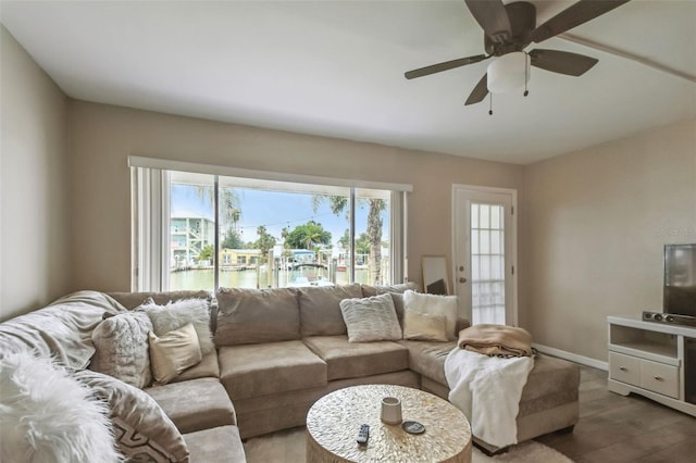 living room featuring hardwood / wood-style flooring and ceiling fan