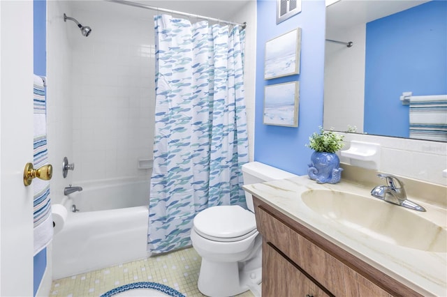 full bathroom featuring shower / bath combo with shower curtain, vanity with extensive cabinet space, tile flooring, and toilet