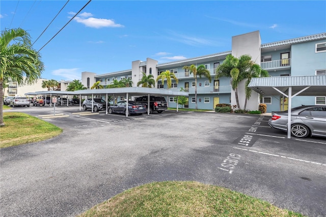 view of vehicle parking featuring a carport