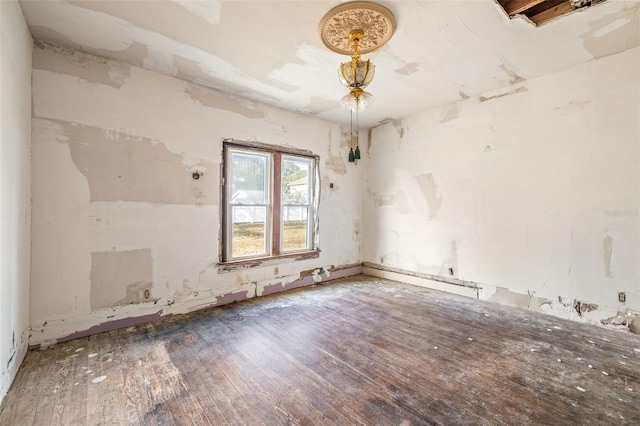 unfurnished room featuring hardwood / wood-style flooring