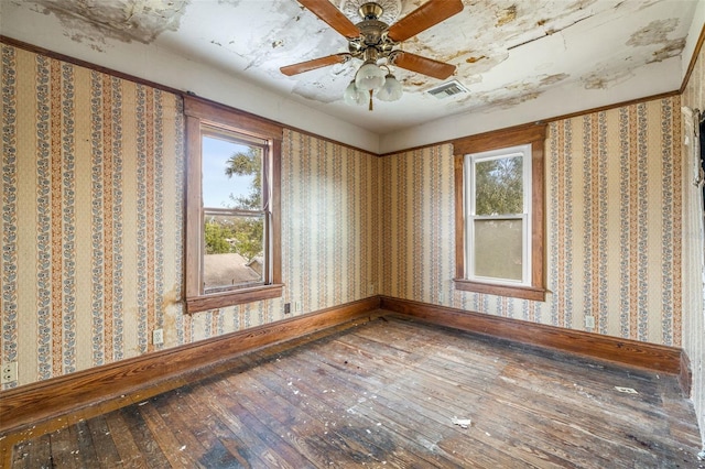 spare room featuring hardwood / wood-style floors and ceiling fan