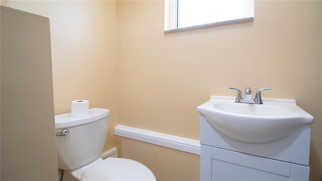 bathroom with toilet and vanity