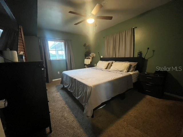 carpeted bedroom featuring ceiling fan