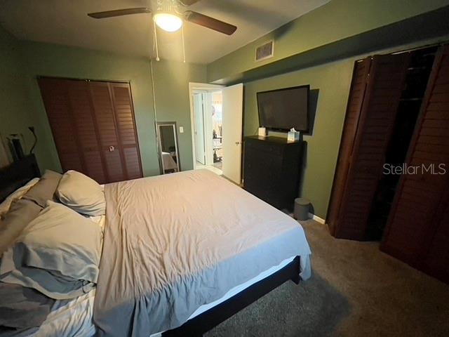 carpeted bedroom with ceiling fan