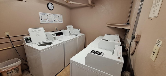 laundry area with independent washer and dryer