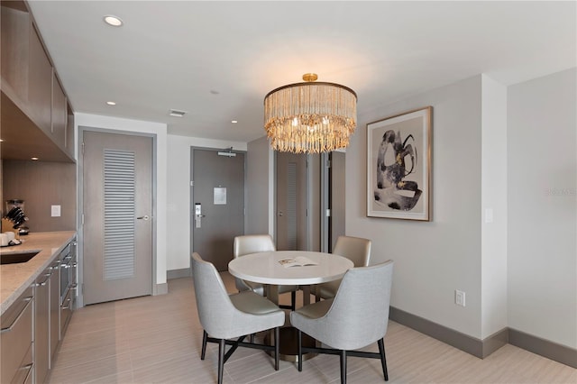 dining area with a notable chandelier