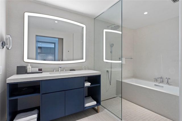 bathroom featuring separate shower and tub and vanity