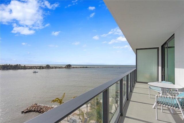 balcony featuring a water view