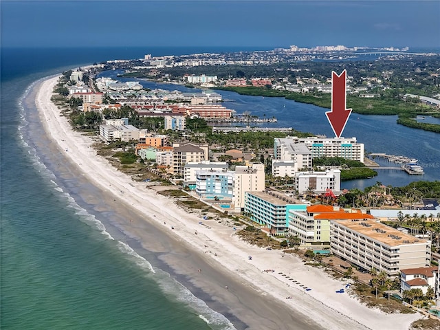 drone / aerial view featuring a water view and a view of the beach