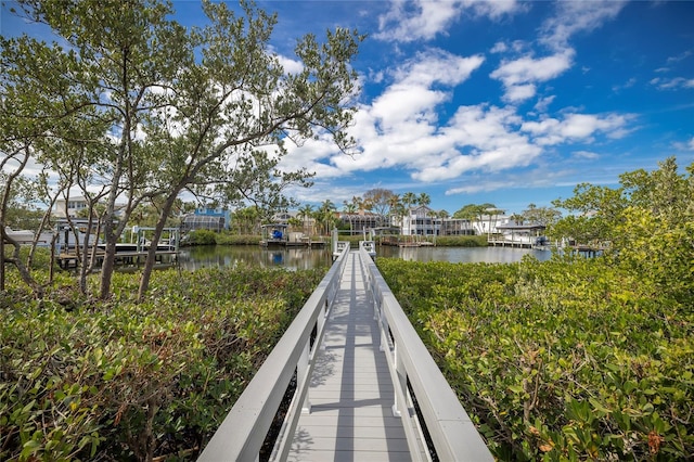 surrounding community featuring a water view