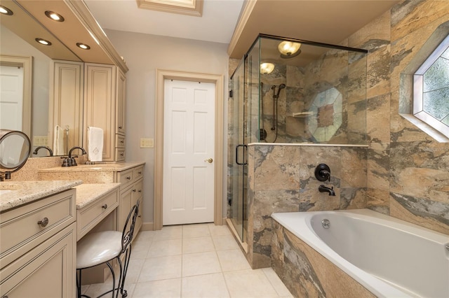 bathroom featuring double vanity, tile flooring, and separate shower and tub