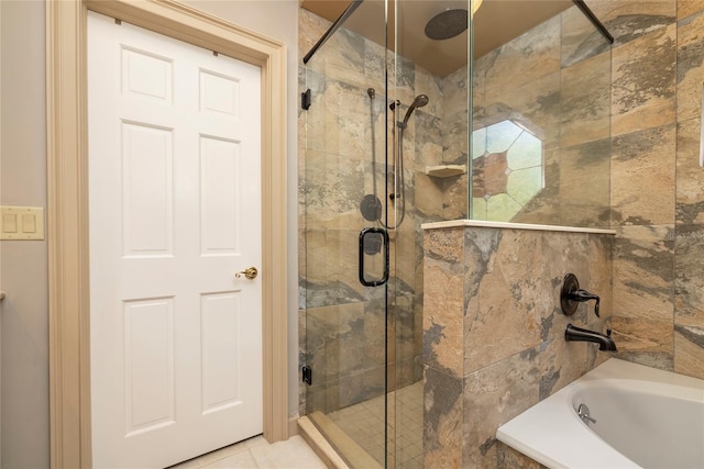 bathroom featuring separate shower and tub and tile floors