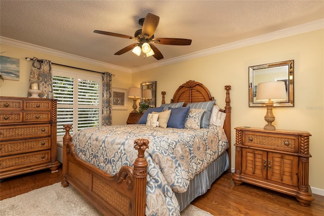 bedroom featuring ceiling fan, crown molding, dark wood-type flooring, and a textured ceiling