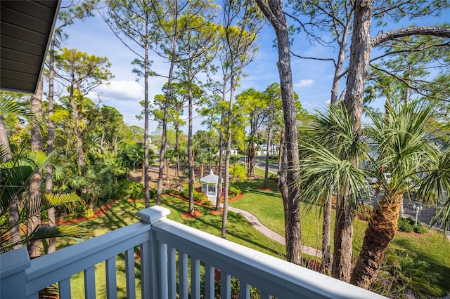 view of yard with a balcony