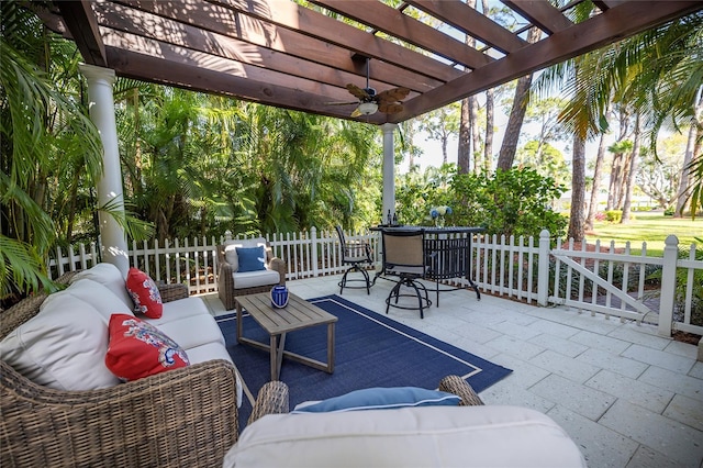 view of patio featuring outdoor lounge area, ceiling fan, and a pergola