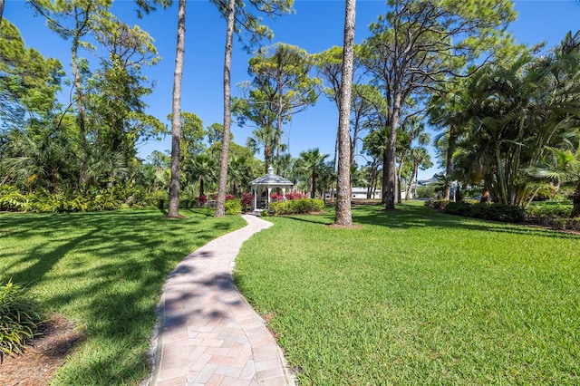 view of property's community featuring a yard and a gazebo