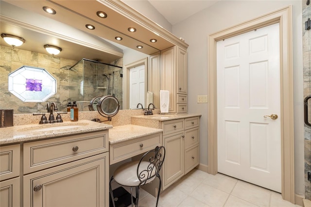 bathroom featuring vanity, an enclosed shower, and tile floors