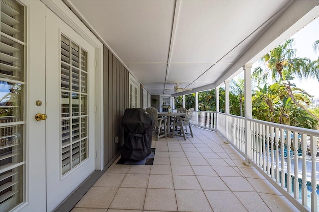 761 Soundview Dr, Palm Harbor, FL 34683 - view of patio / terrace with outdoor dining space, ceiling fan, a balcony, and area for grilling
