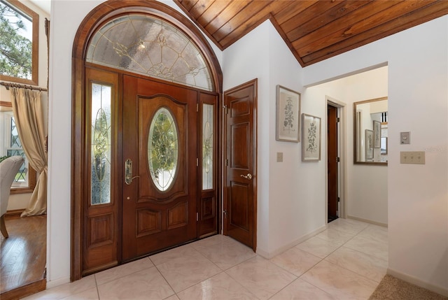761 Soundview Dr, Palm Harbor, FL 34683 - entryway featuring wooden ceiling, vaulted ceiling, and baseboards