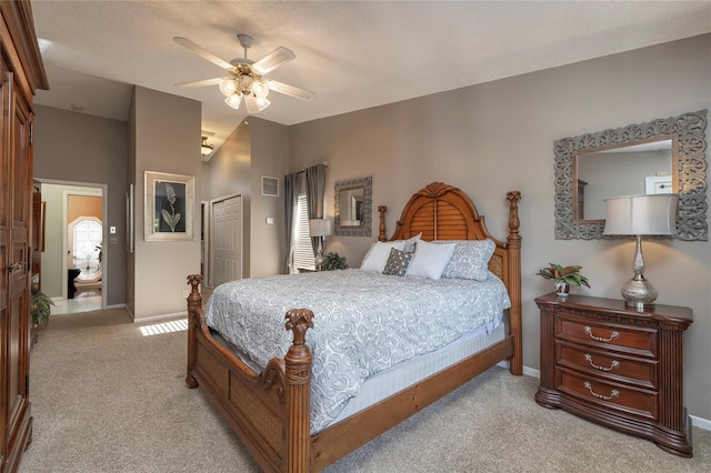 761 Soundview Dr, Palm Harbor, FL 34683 - bedroom with carpet flooring, a closet, lofted ceiling, baseboards, and a ceiling fan