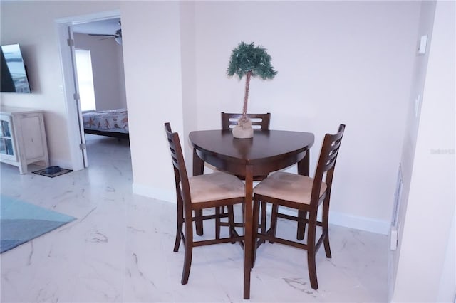 dining area with ceiling fan