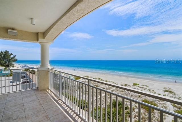 balcony with a view of the beach and a water view