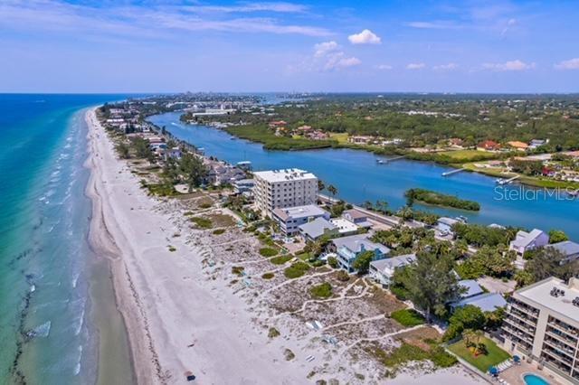 bird's eye view featuring a beach view and a water view