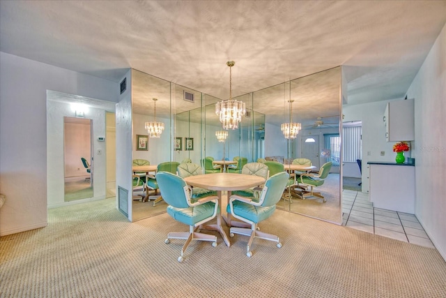 carpeted dining room featuring ceiling fan