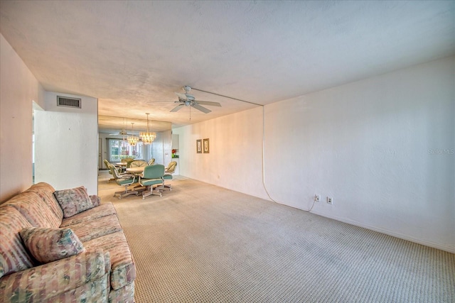 living room with carpet floors and ceiling fan