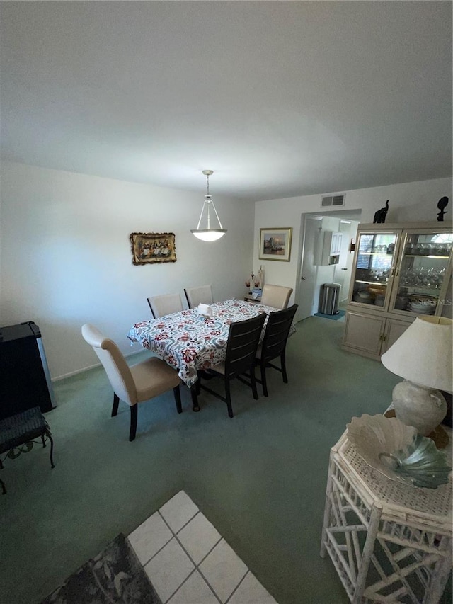 view of carpeted dining space