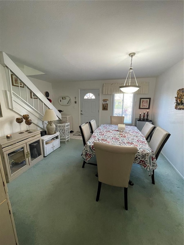 view of carpeted dining space