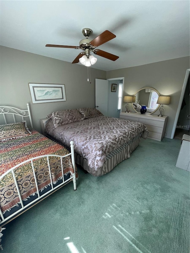 bedroom with ceiling fan and carpet floors