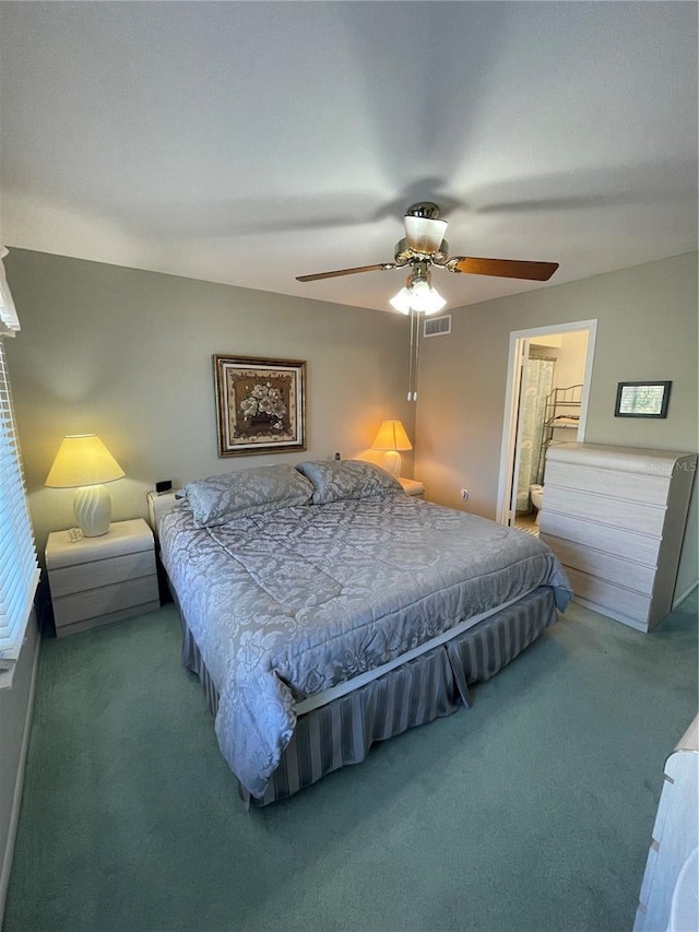 carpeted bedroom with ceiling fan and connected bathroom