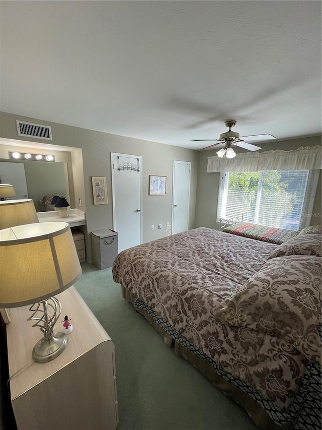 bedroom with ceiling fan and carpet floors