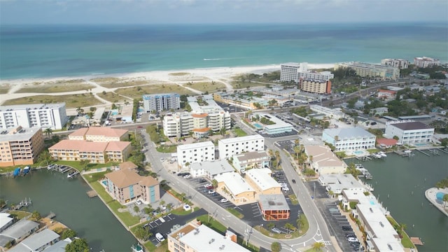 drone / aerial view with a water view and a view of the beach