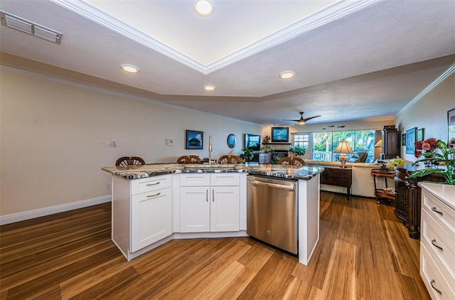 kitchen with white cabinetry, dishwasher, ceiling fan, hardwood / wood-style floors, and ornamental molding