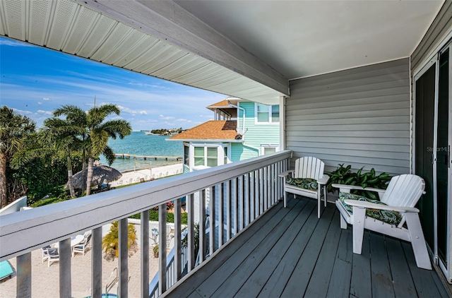 balcony featuring a water view