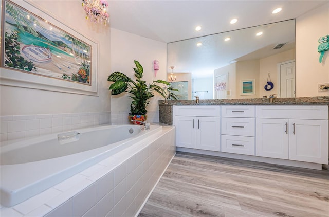 bathroom with hardwood / wood-style flooring and vanity