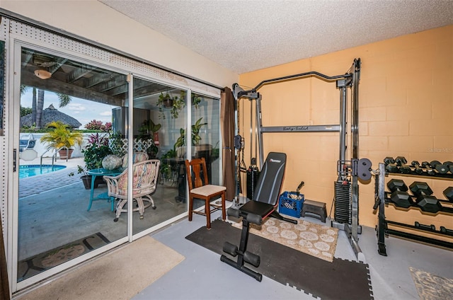 exercise area with a textured ceiling